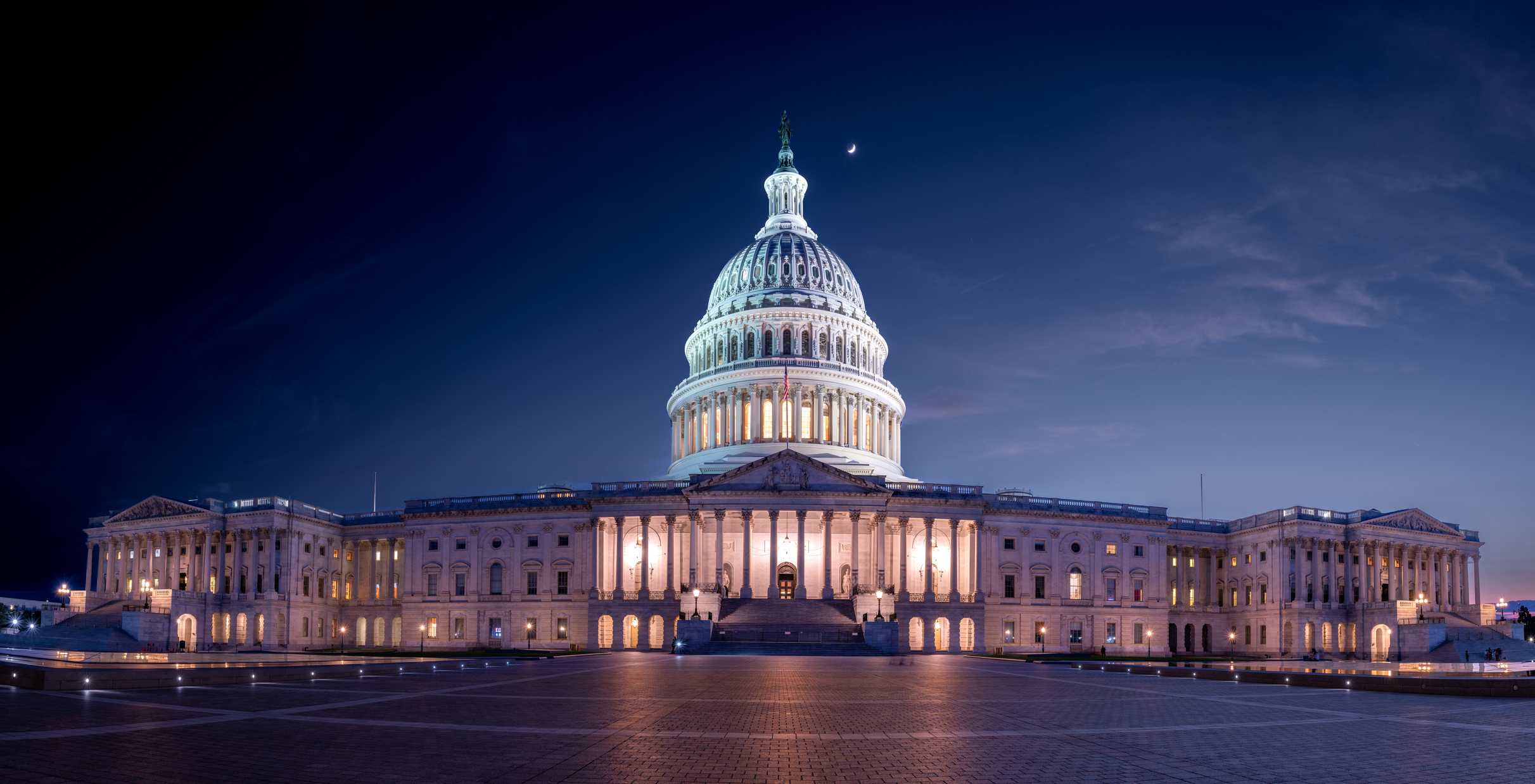 Panoramic view of the U.S. Capitol at night.