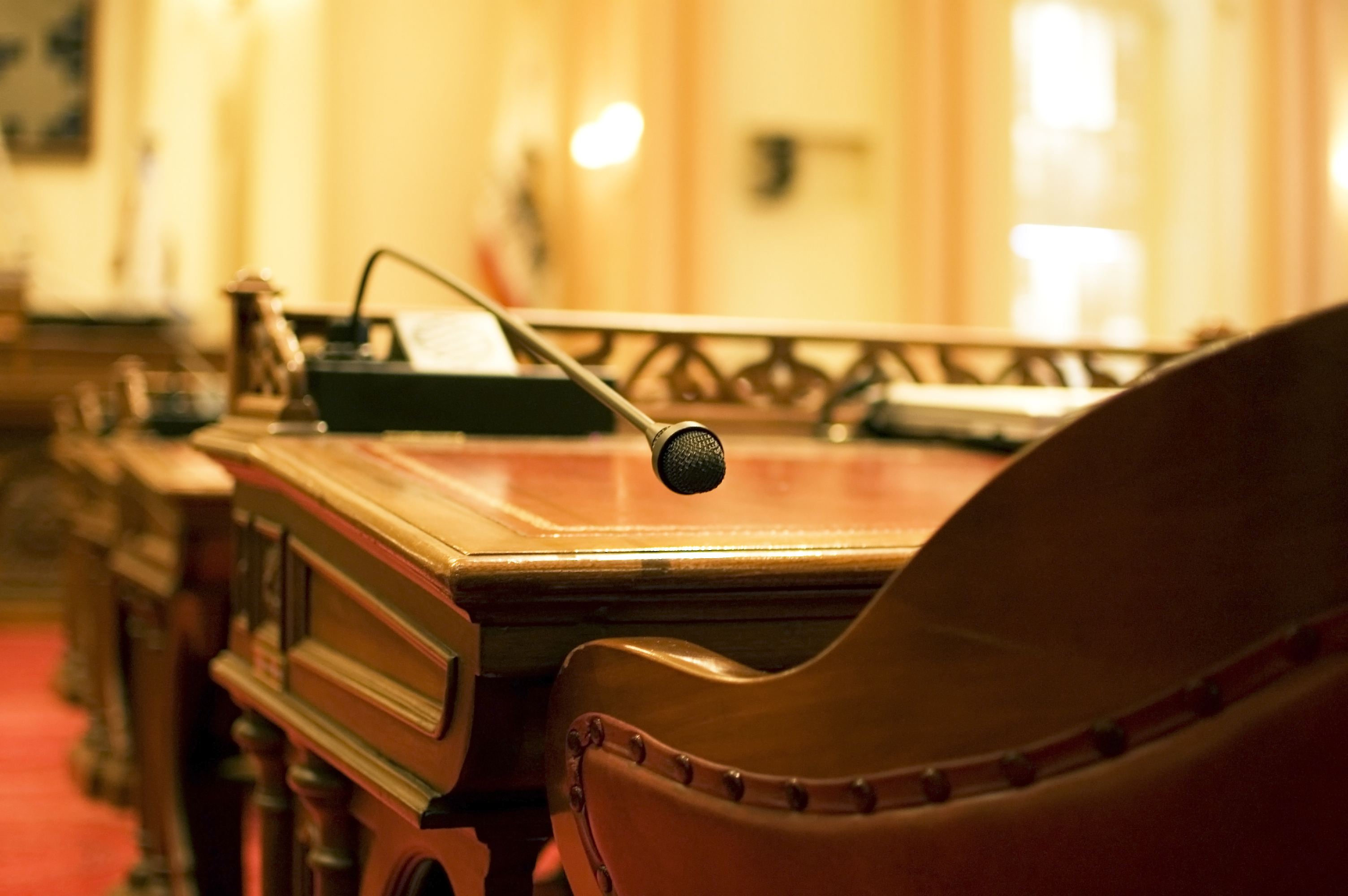 Photo of a desk in a legislative chamber.