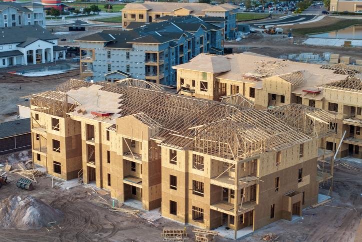 Photo of an apartment community under construction.