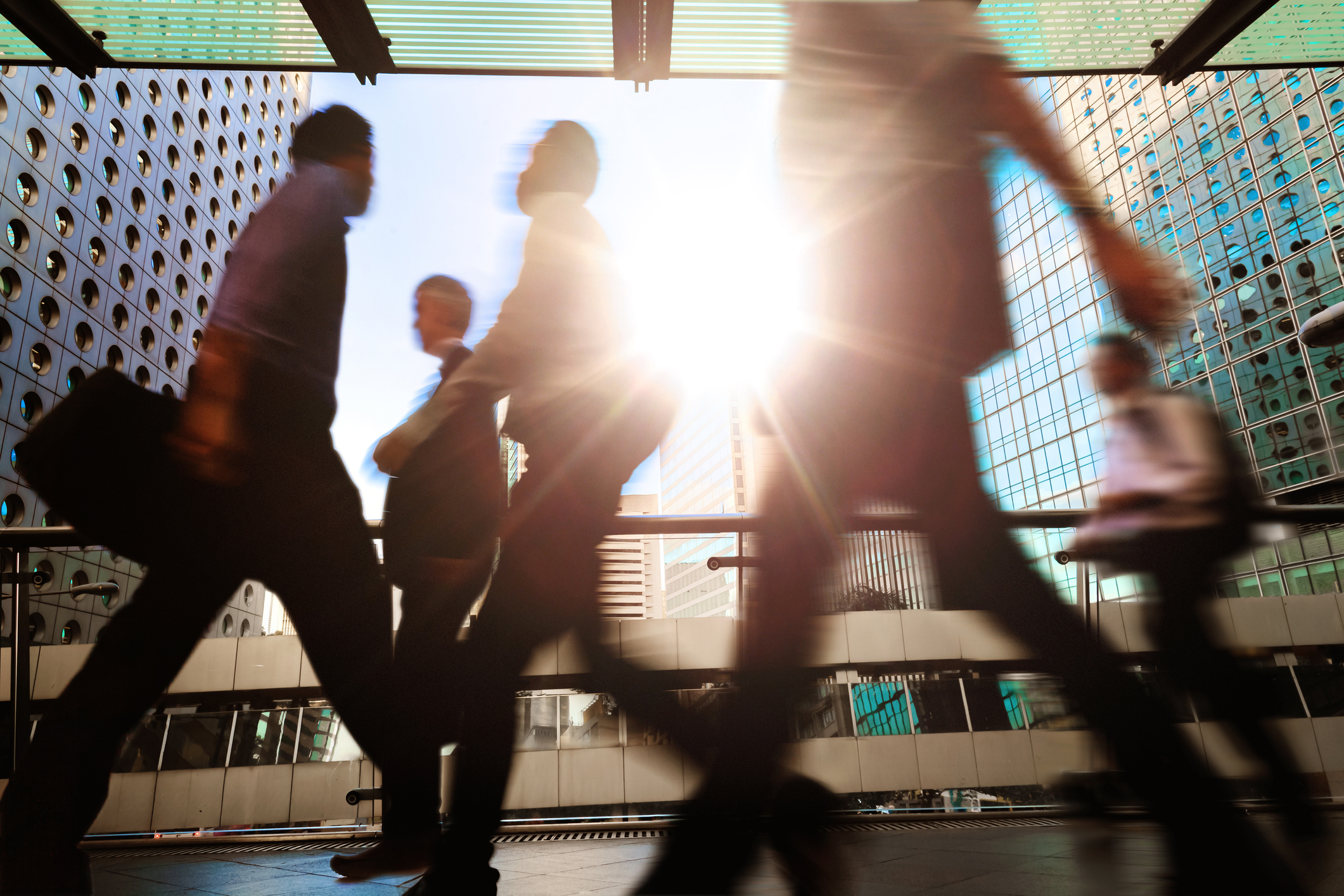 business people walking in a city