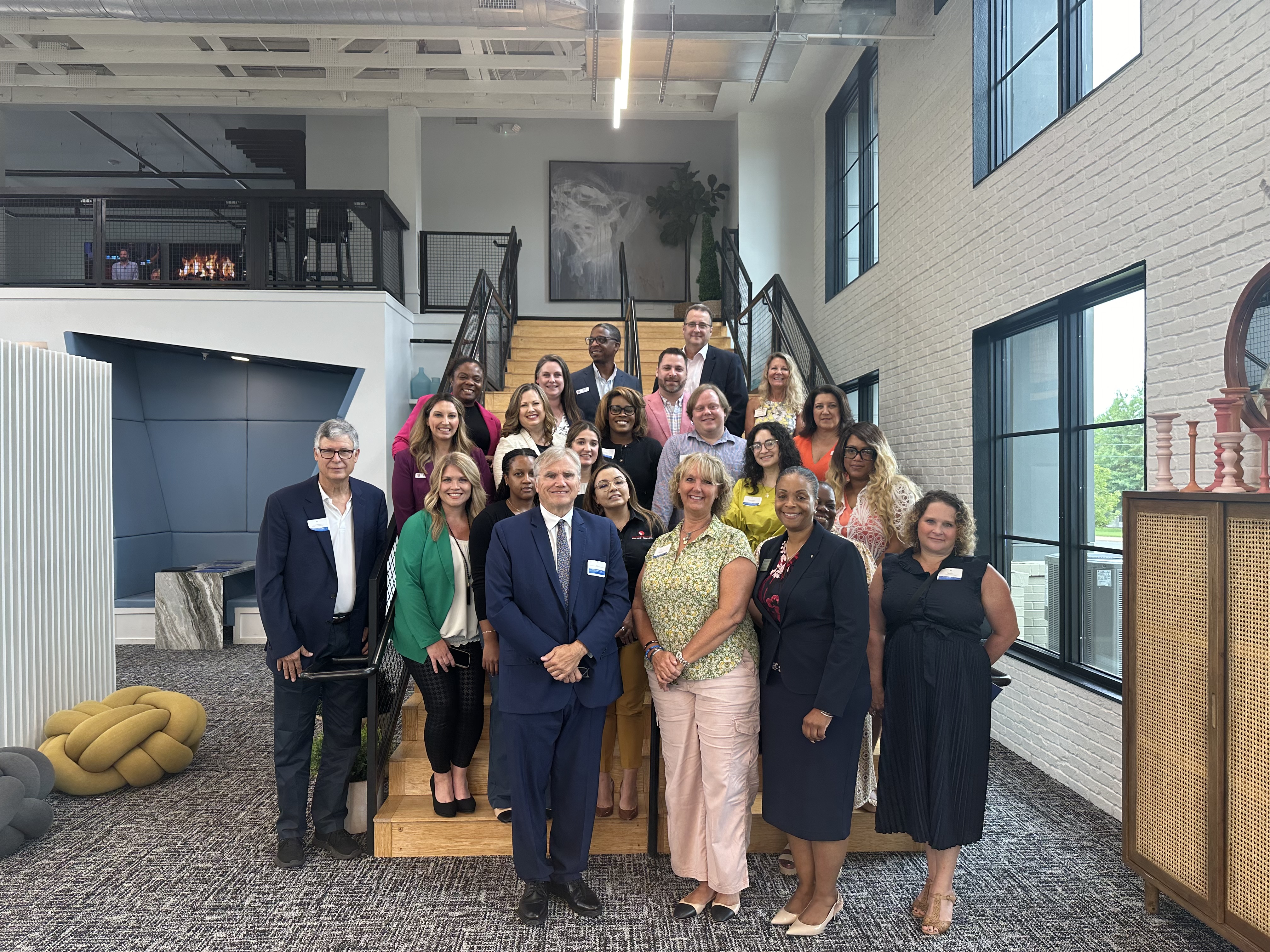 PDAS Rich Monocchio and GCAA Board President Gabrielle Bouknight join local leaders for a photo following the roundtable discussion.