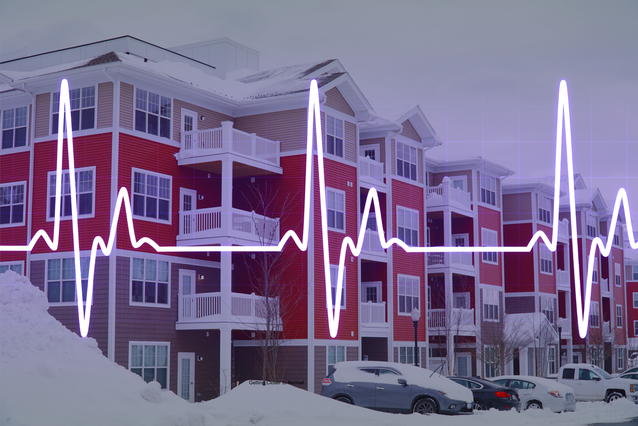 apartment building with snow on it, with pulse icon overlaid