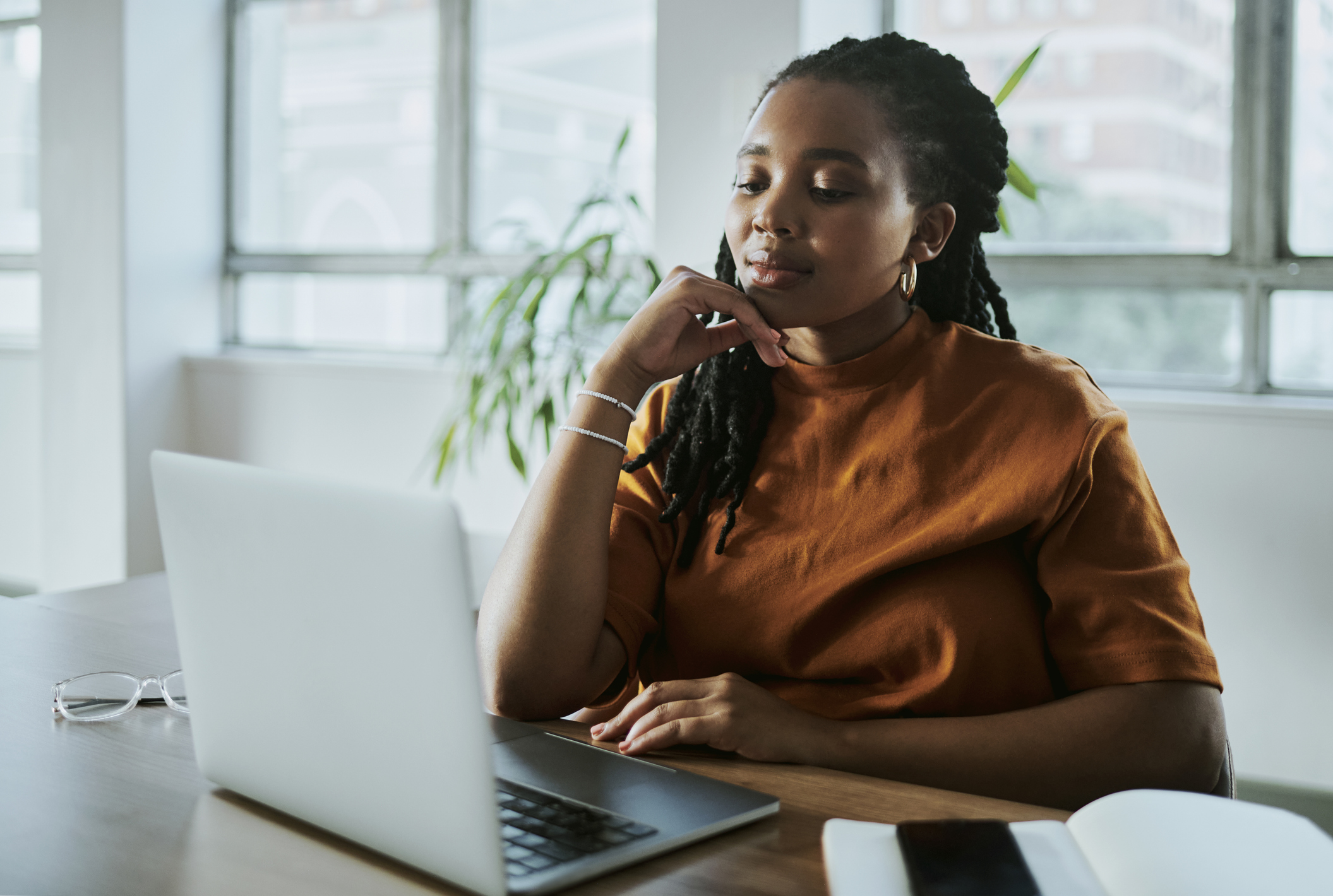 woman sitting in front of computer