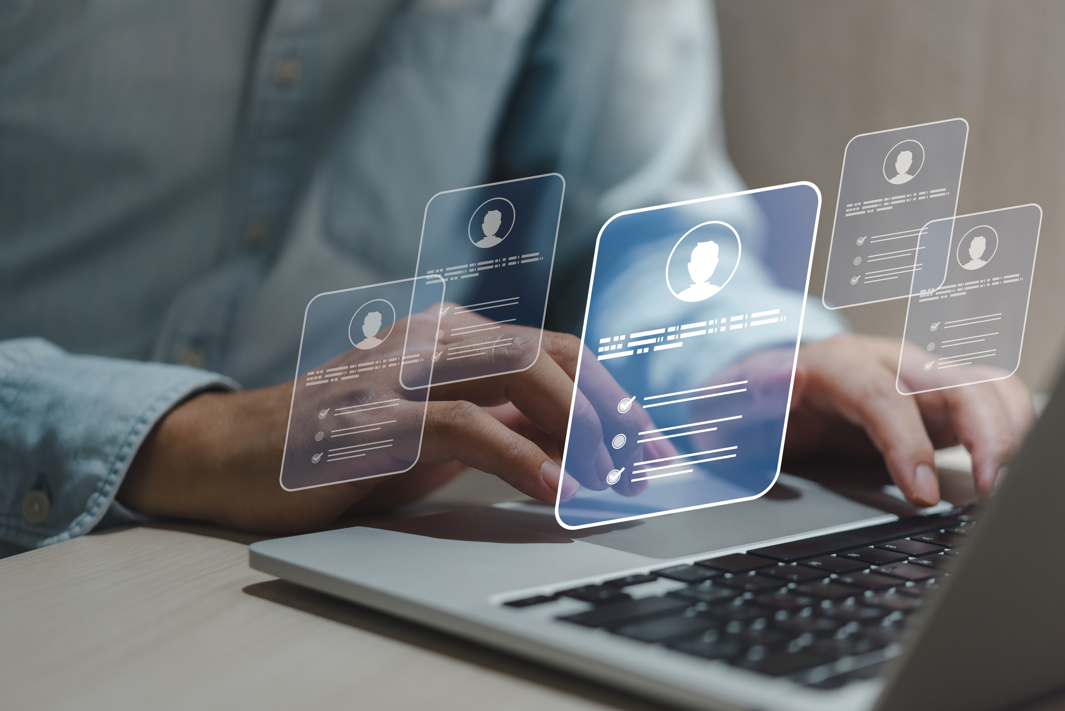 person selecting job candidate on computer