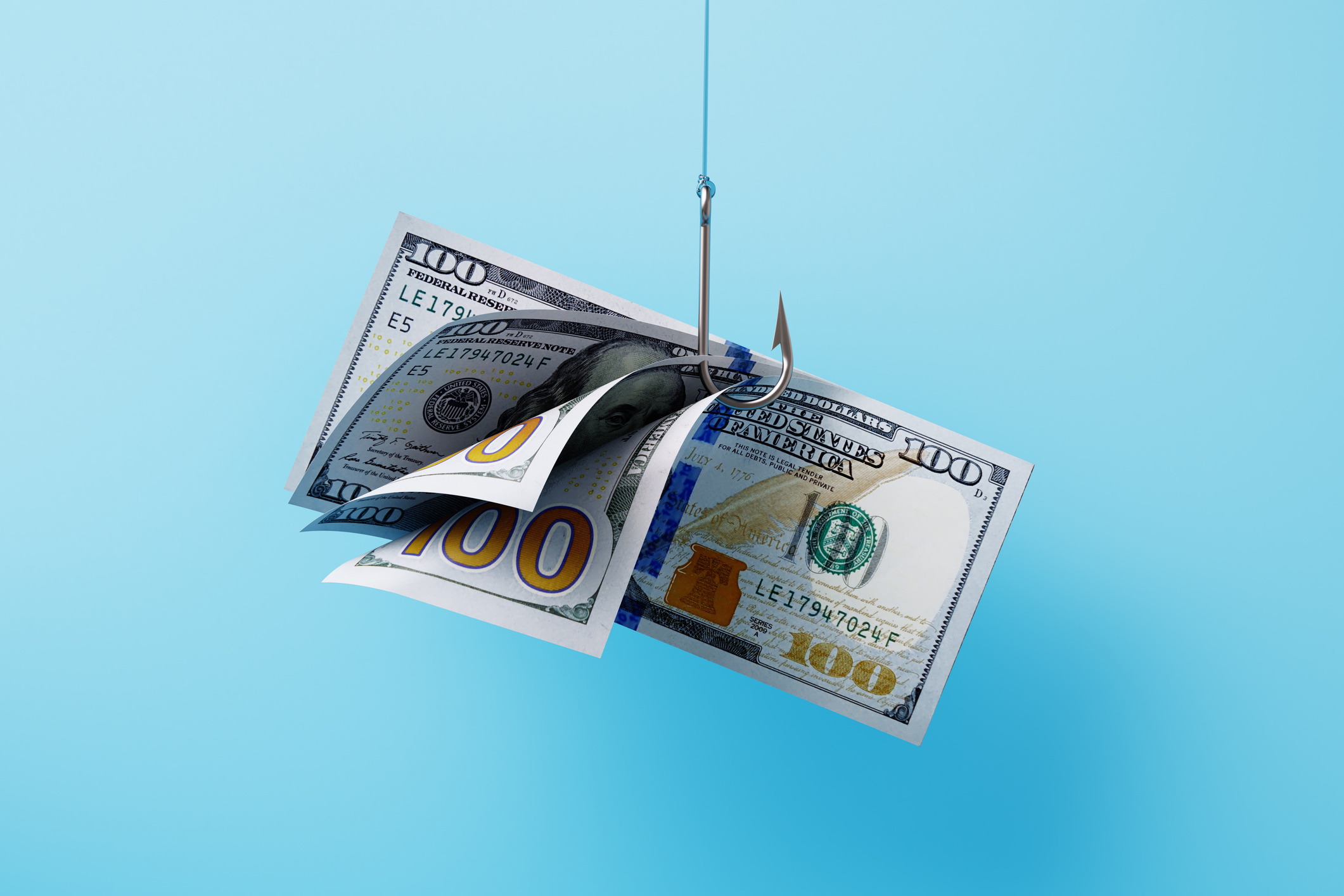 a fishing hook with $100 bills