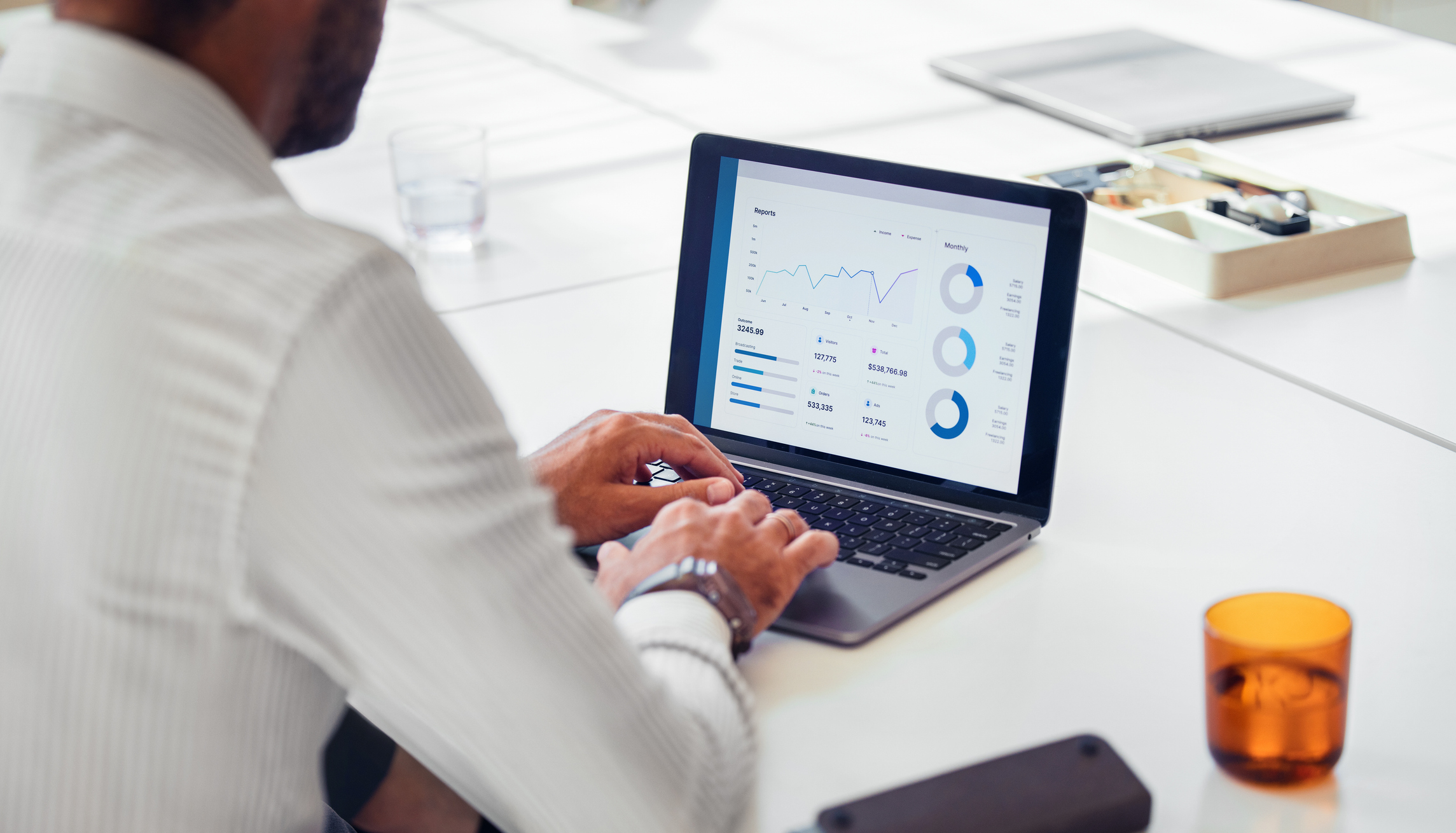 man looking at data on computer