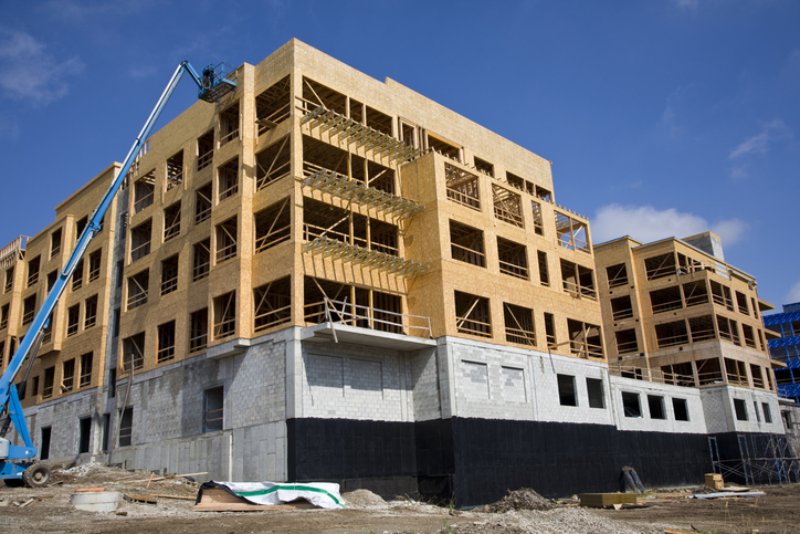 Photo of an apartment community under construction.