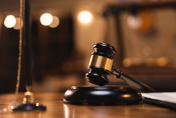 Photo of a courtroom gavel.