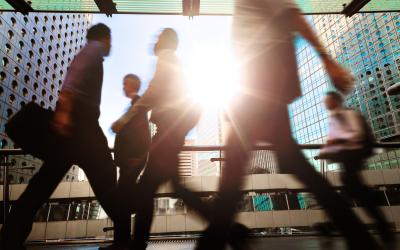 business people walking in a city