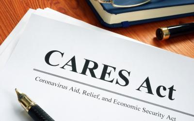 paper with the words "CARES Act" written on it, with the subtitle "Coronavirus Aid, Relief, and Economic Security Act"