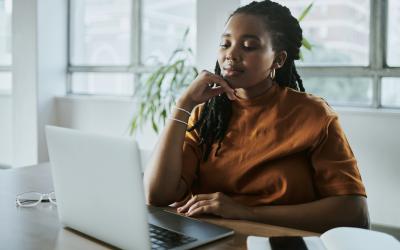 woman sitting in front of computer