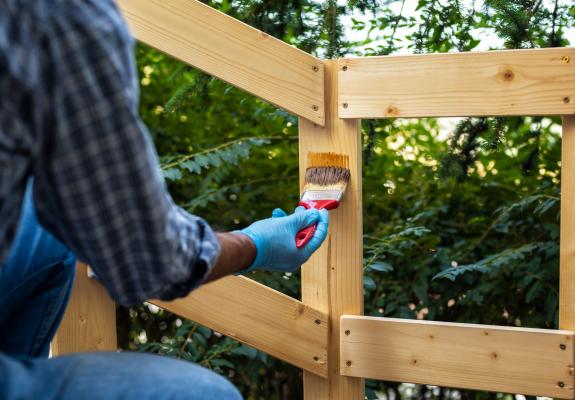 man working on fence