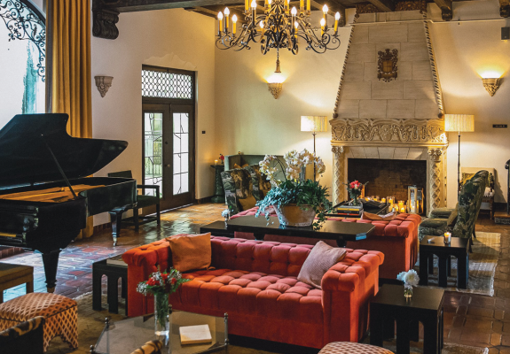 lavish apartment with fireplace and grand piano