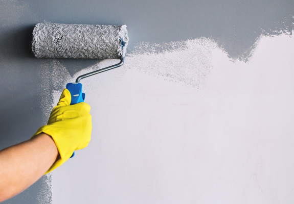 man painting a wall