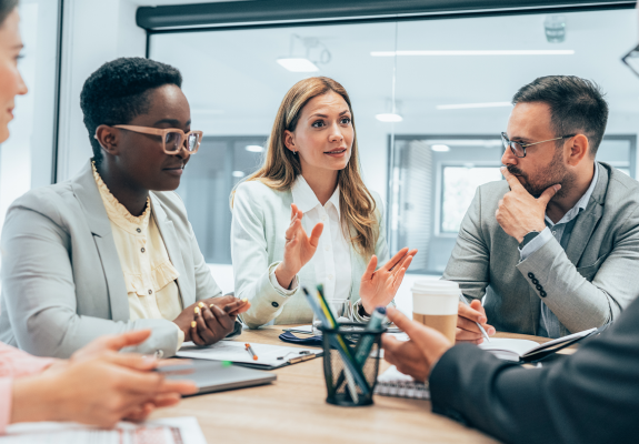 five people in a business meeting