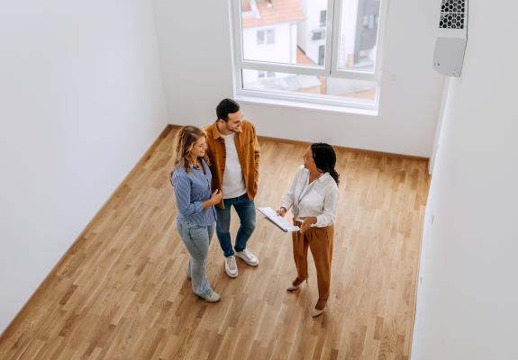 property manager showing an apartment to residents