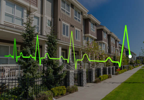 apartment exterior with heart monitor graph overlaid