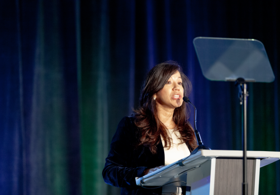 Crystal Moya speaking at award ceremony.