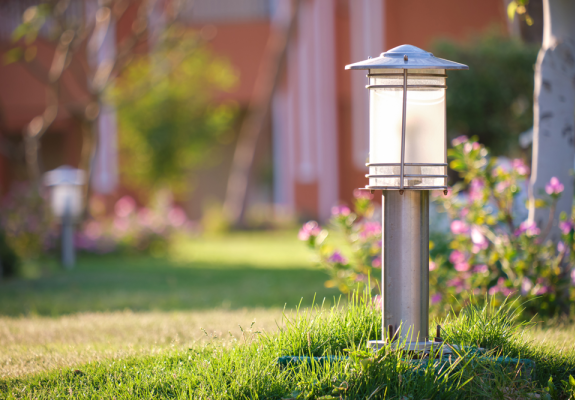 Lamp post in a yard. 
