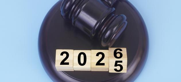 a gavel and tiles flipping from 2025 to 2026