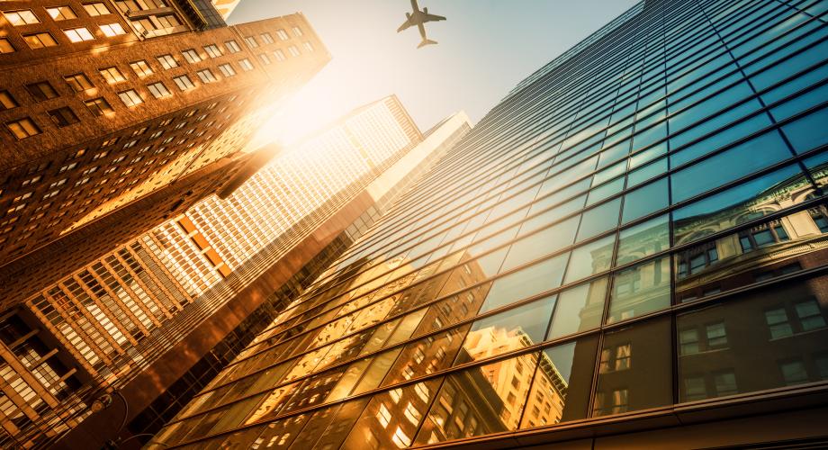 city skyline with airplane
