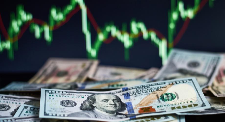 100-dollar bills with graph image overlaid