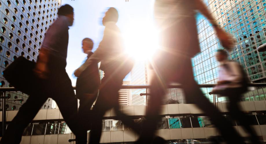 business people walking in a city