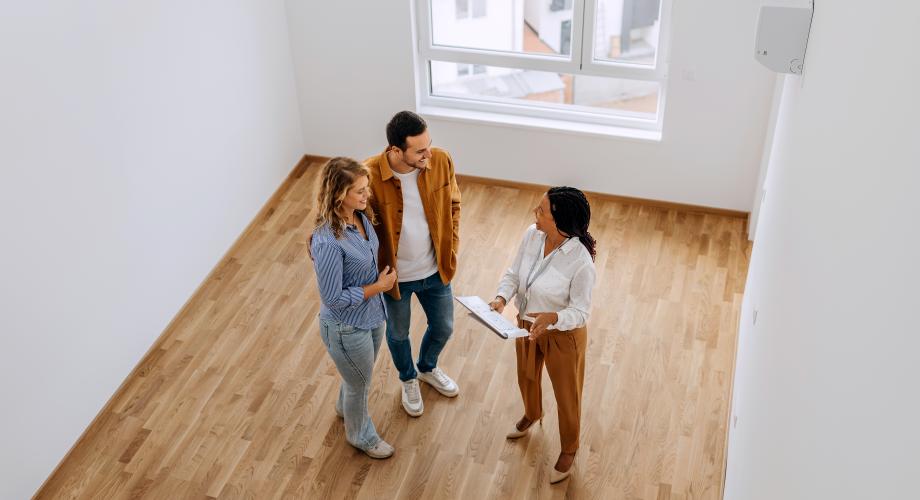 property manager showing an apartment to residents