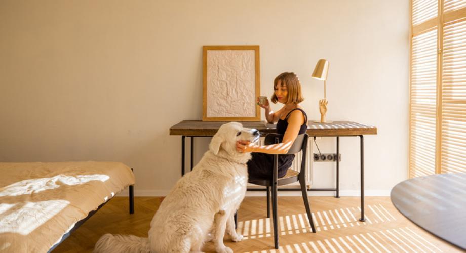 woman with dog in apartment