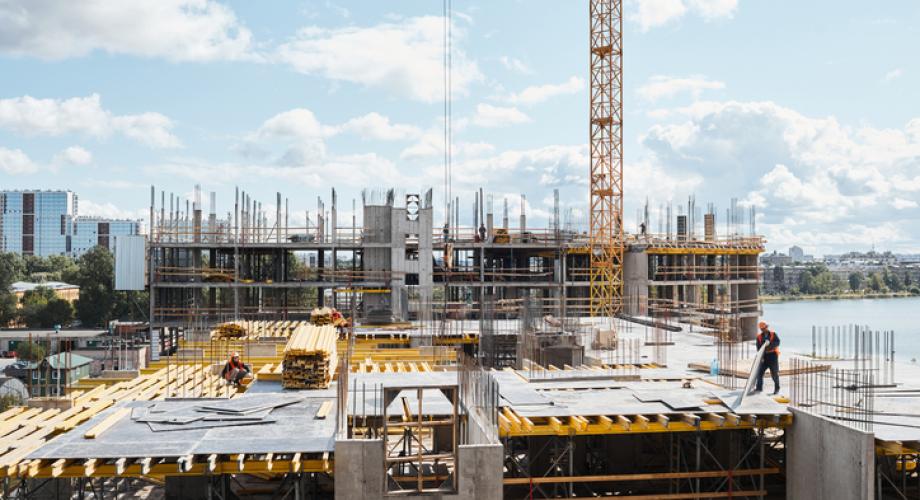 Photo of an apartment community under construction.