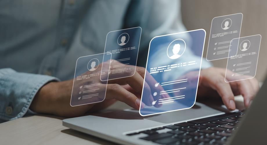 person selecting job candidate on computer