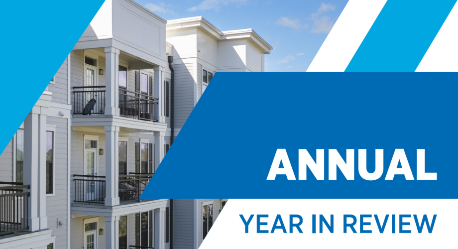 modern apartment exterior with "Annual Year in Review" overlaid