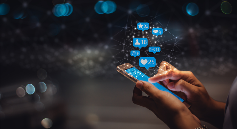 person using phone with social media icons overlaid