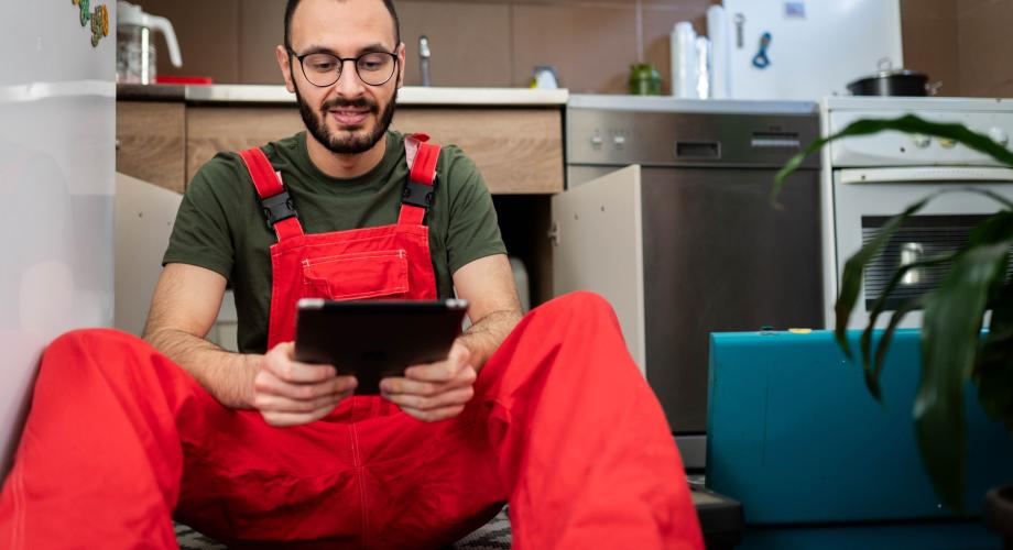 maintenance tech looking at ipad
