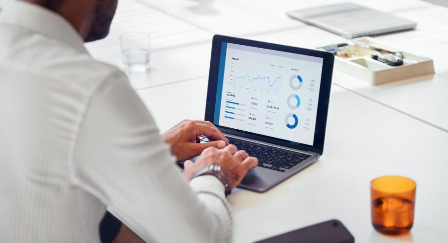 man looking at data on computer