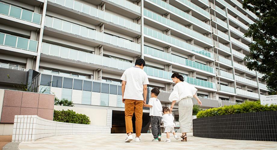 family walking into building