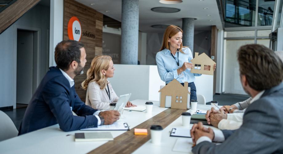 Employees in a conference room working together