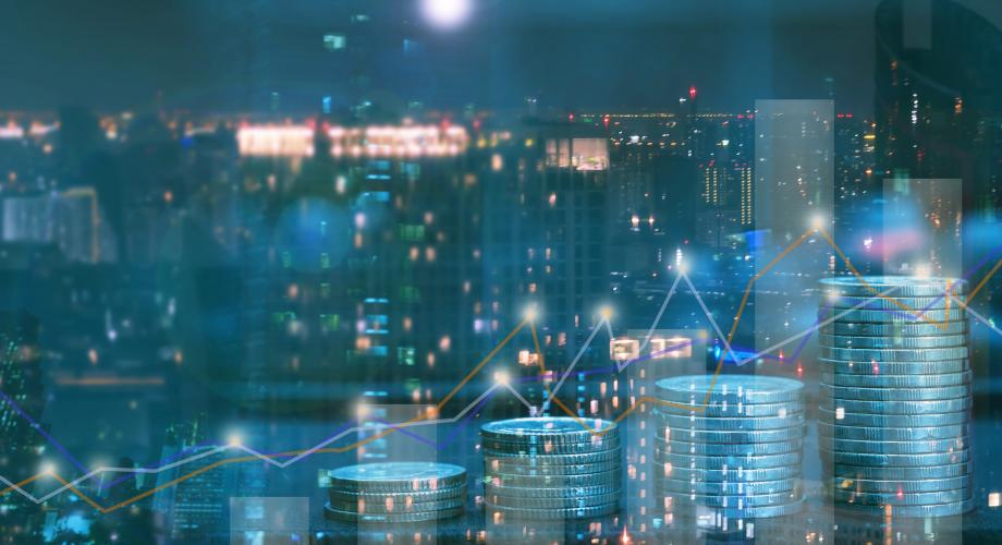 city skyline with coins and chart overlaid