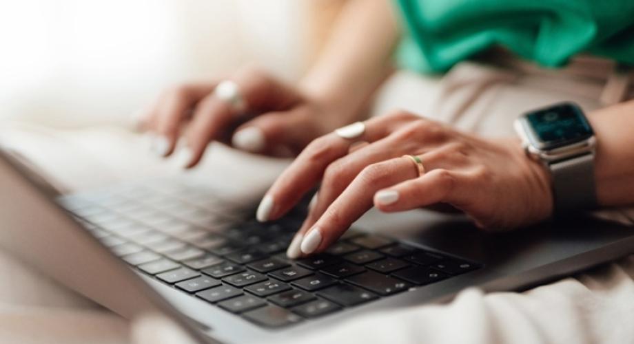 woman typing on computer