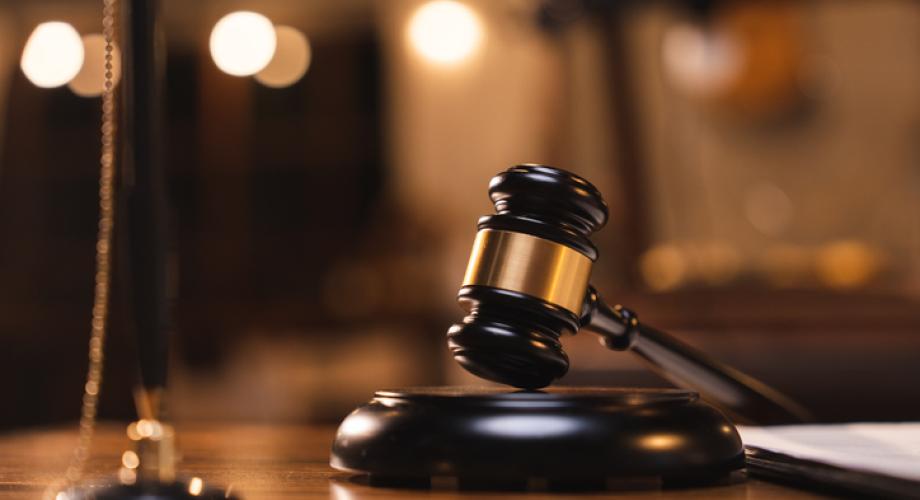 Photo of a courtroom gavel.