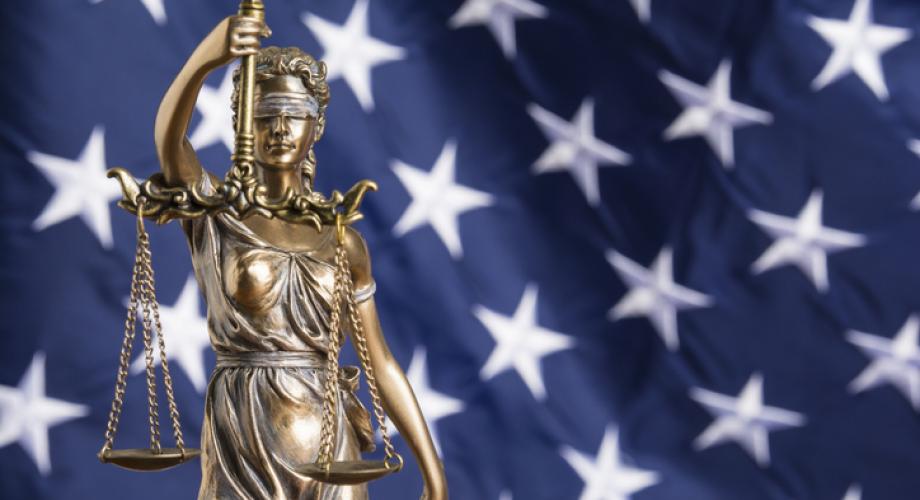 lady justice in front of American flag