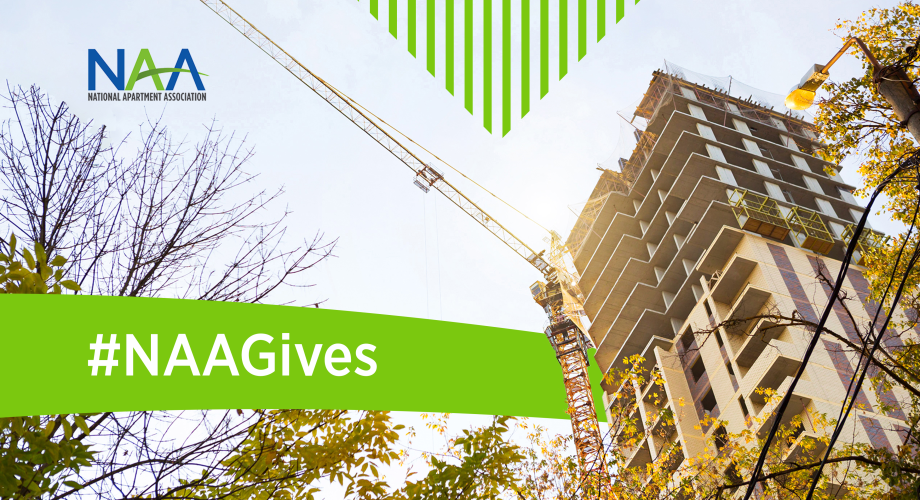 apartment building under construction with text "#NAAGives" overlaid