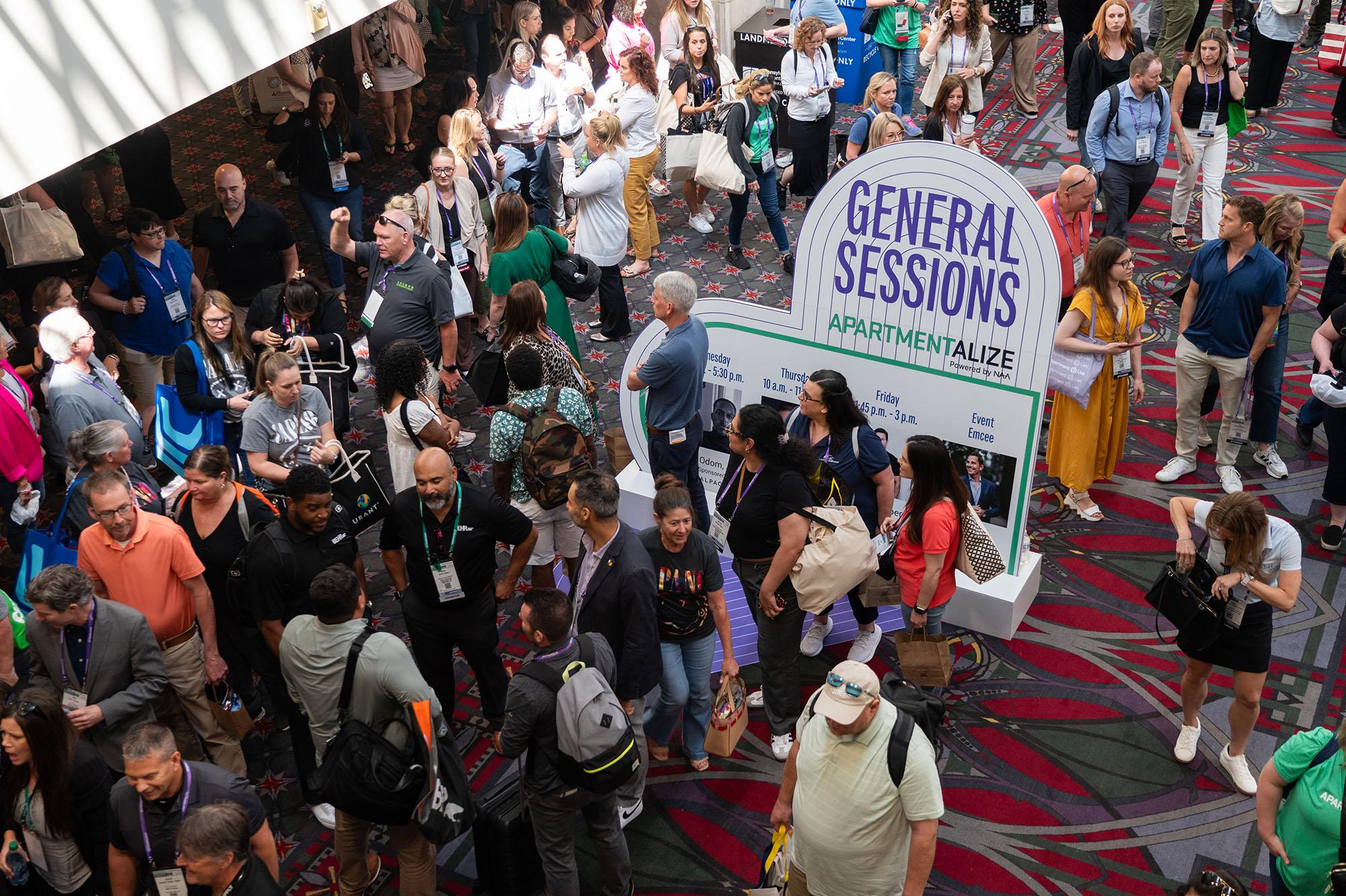 Attendees eagerly wait the opening of the doors for Friday’s Closing General Session at Apartmentalize.