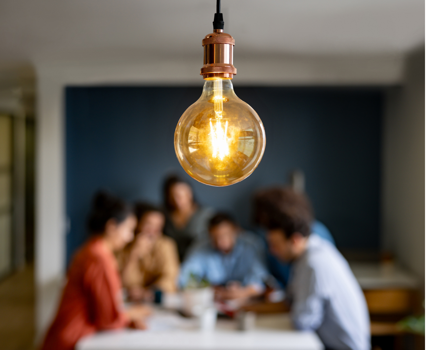 lightbulb with people behind