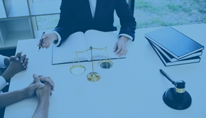 two people meeting with a lawyer